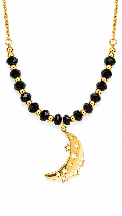 Collar de ónix negro con colgante dorado de luna creciente y estrellas.
