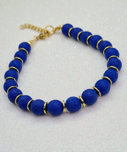 Pulsera de Lava Volcánica y Discos Dorados para mujer.